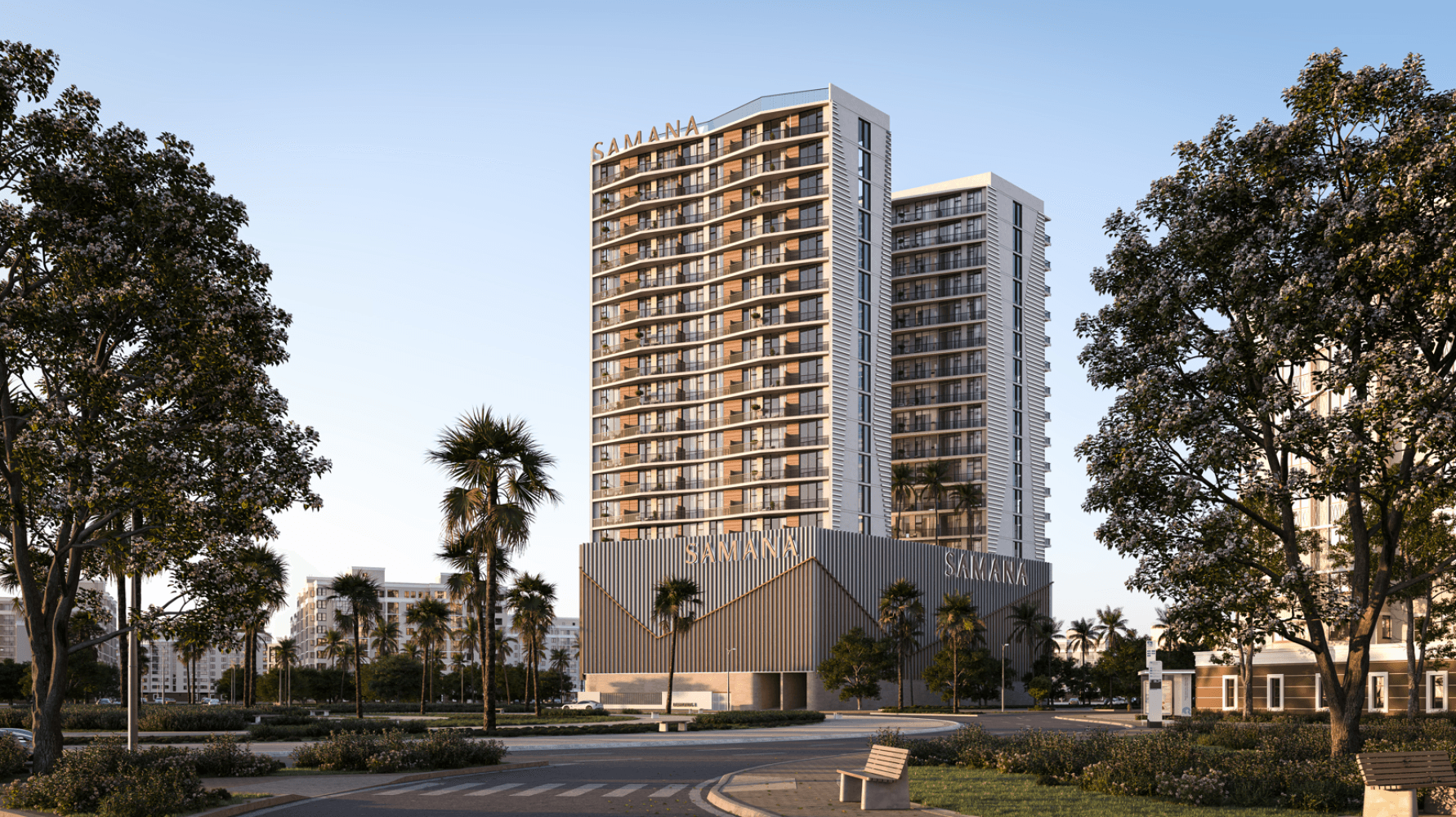 SAMANA Greenfield's twin residential towers seen through mature trees in Warsan